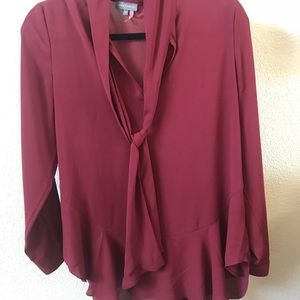 Vince Camuto top with a ruffled design on bottom